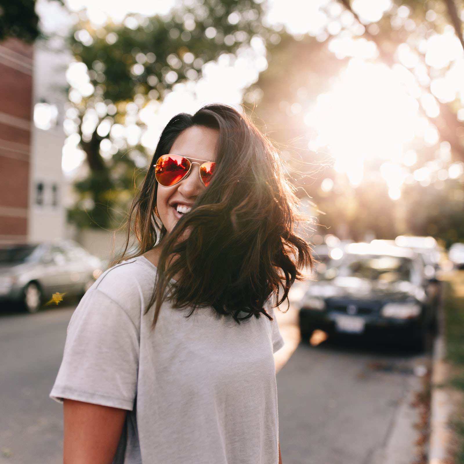 girl with sunglasses smiling